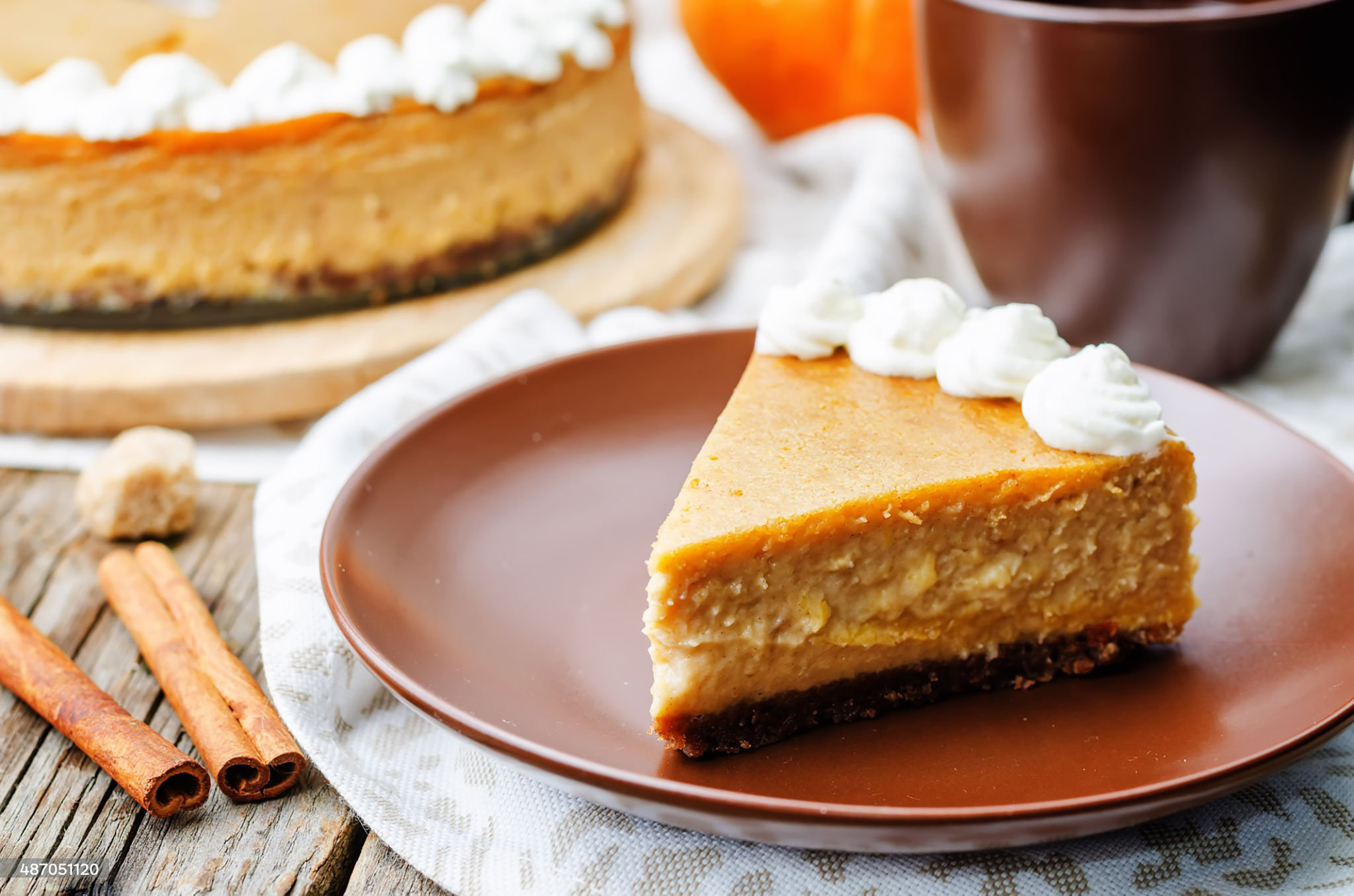 pumpkin cheesecake decorated with whipped cream. the toning. selective focus